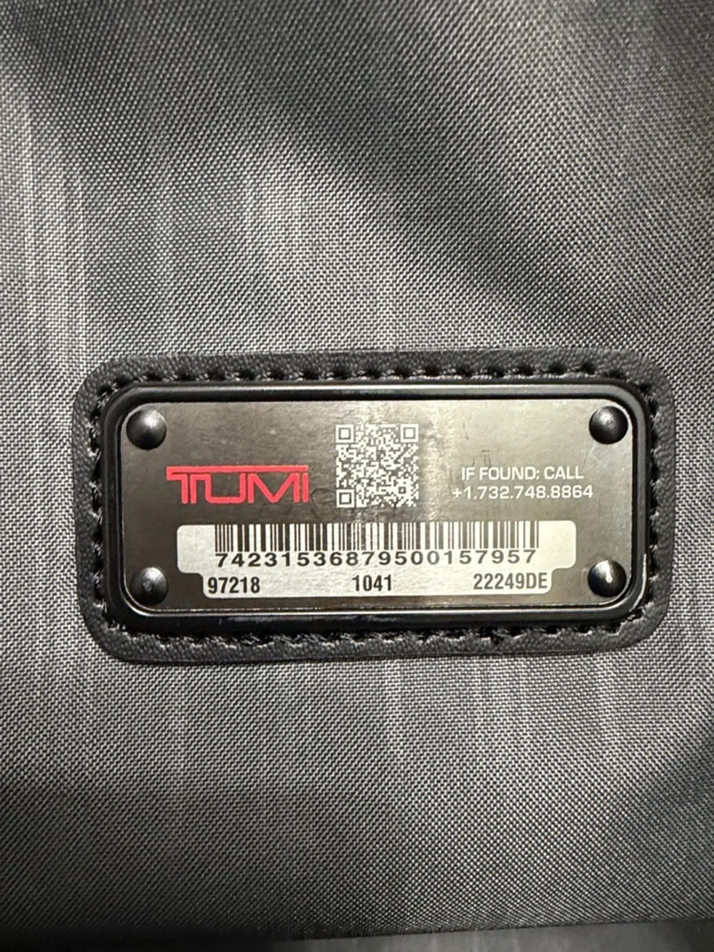 Tumi Black Travel Duffel with Red Logo Accent